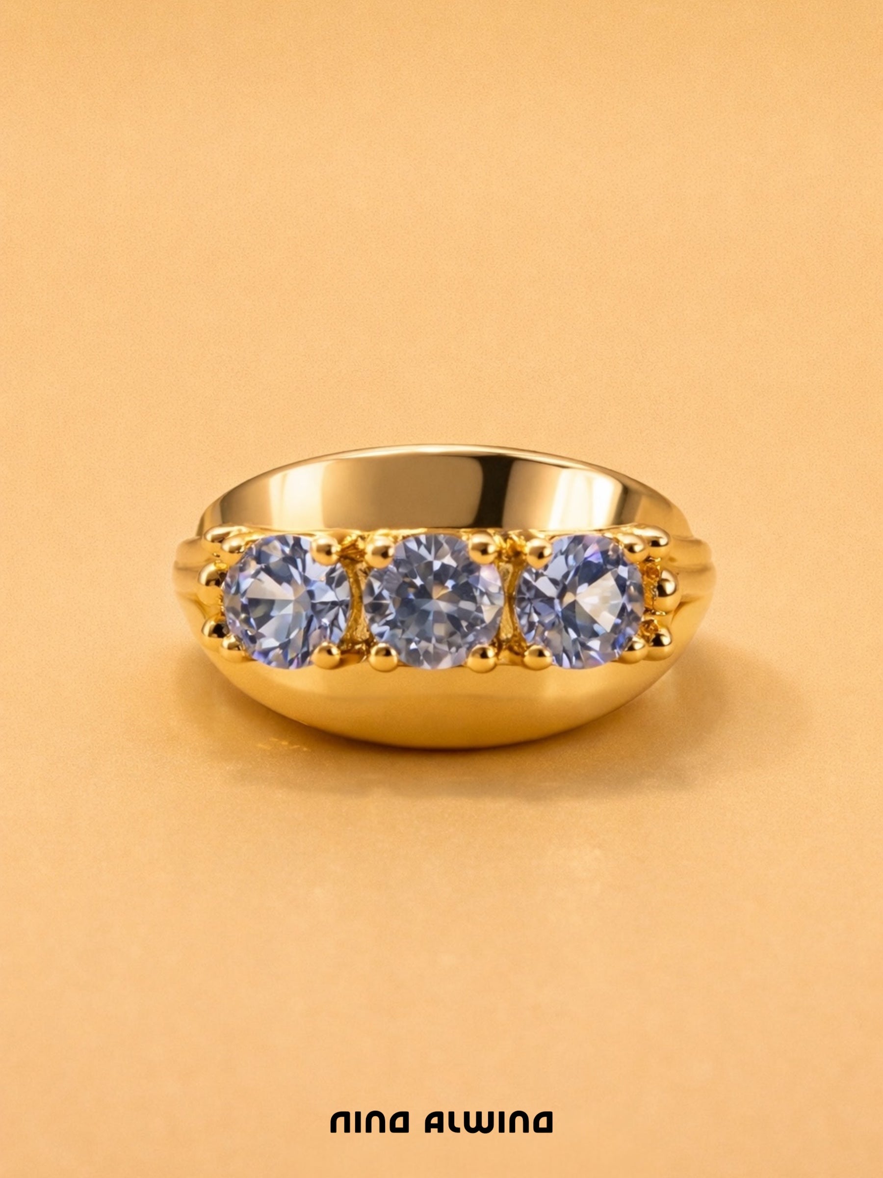 #652 8k Ring mit 3 Blautopas - RG 56